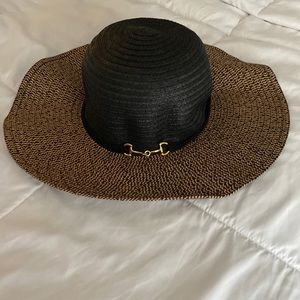 Black and tan floppy hat with gold buckle detail